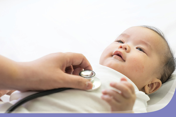 Image of content newborn being cared for by nurse.
