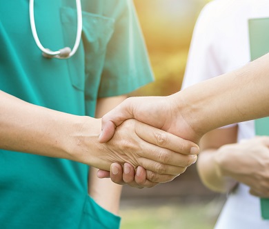 Medical team shaking hands